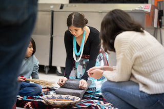 student making traditional indigenous tamales