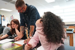 Teacher talking with students
