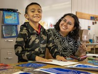 Elementary school art student and teacher