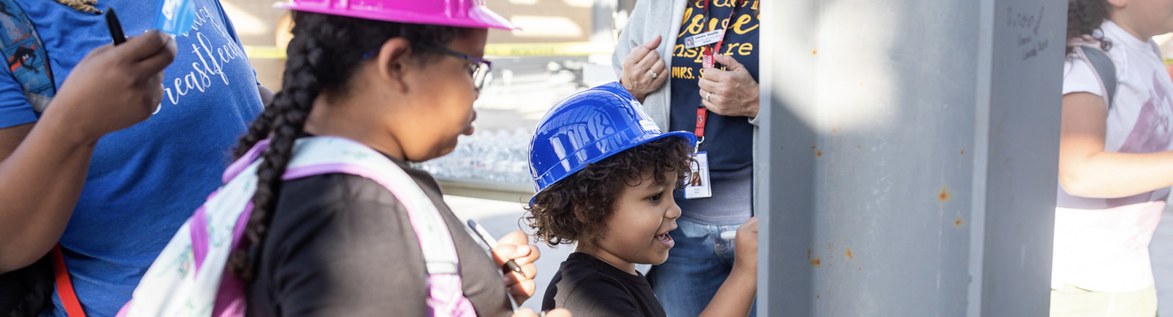 students wearing hard hats