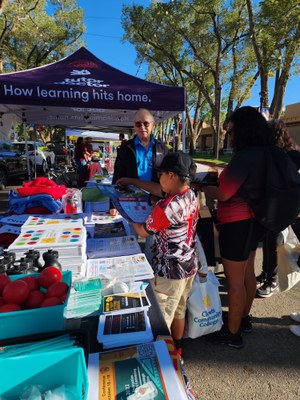 NM State Fair Pathway to College & Careers Day 2022 - George in conversation with a student and parent