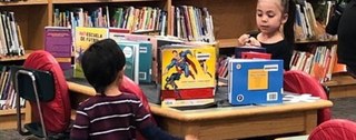 elementary students in a library