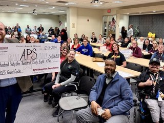 Pepsi Award winners posing with big check