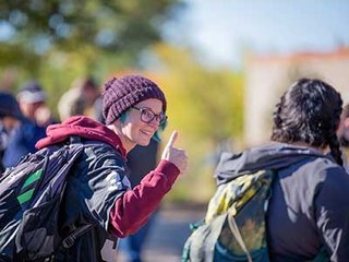 high school student giving a thumbs up