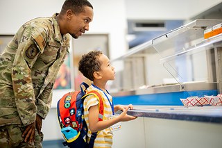 Military Family (500x334) 2025 JPG Air Force personnel with student at lunch