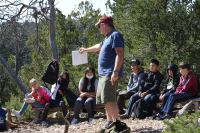 Paul showing students wildlife camera photos during their Ecology Field Program.